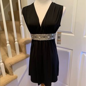NWT, short black dress w embellishment at waist.